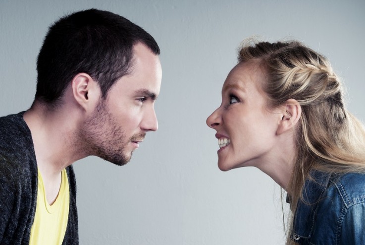 Young couple has a big argument or heated discussion Thermostat arguments hotting up with winter now upon us!