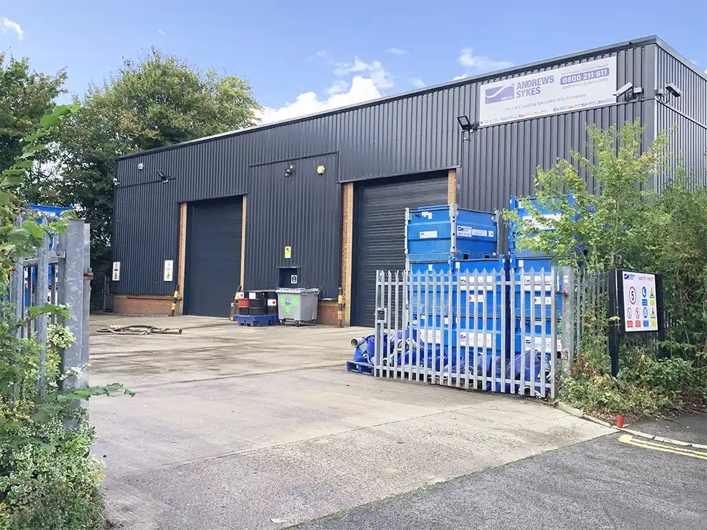Andrews Sykes North West depot yard in Irlam, Manchester Exterior view of Andrews Sykes’ new North West depot in Irlam, Manchester, showing the secure yard with pumps and hire equipment.