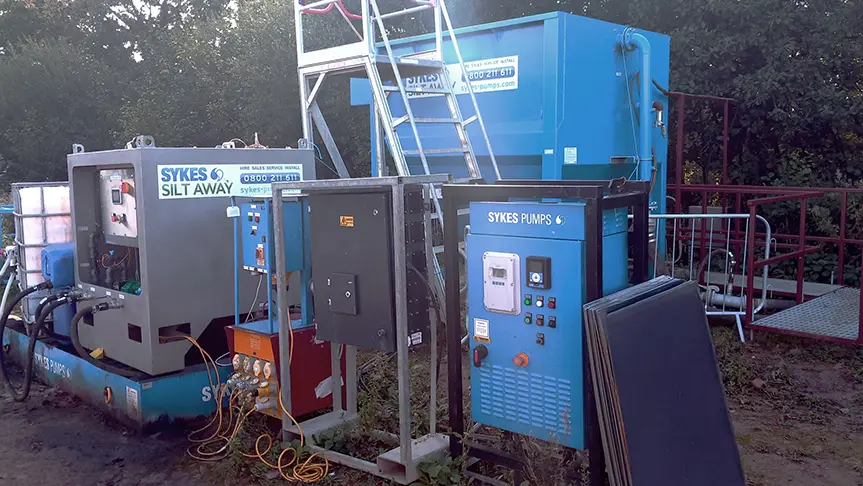 Sykes Pumps Silt Away chemical dosing and monitoring system with control panels and clarifier used for quarry lake dewatering in West Sussex.