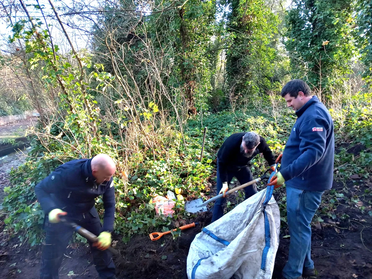Volunteers shoveling soil
