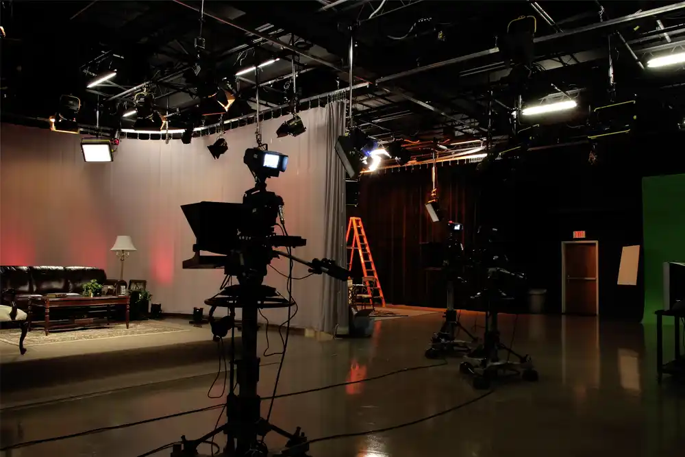 A fully equipped film Studio Sound Stage in Surrey with lighting rigs and set design, requiring precise temperature control for cast and crew comfort.