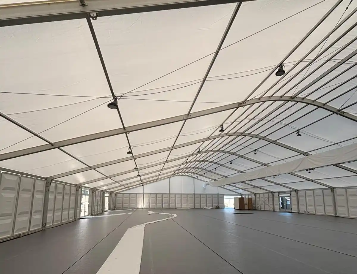 Interior of marquee before copleted cooling installation Interior view of a large white event marquee before air conditioning ducting installation
