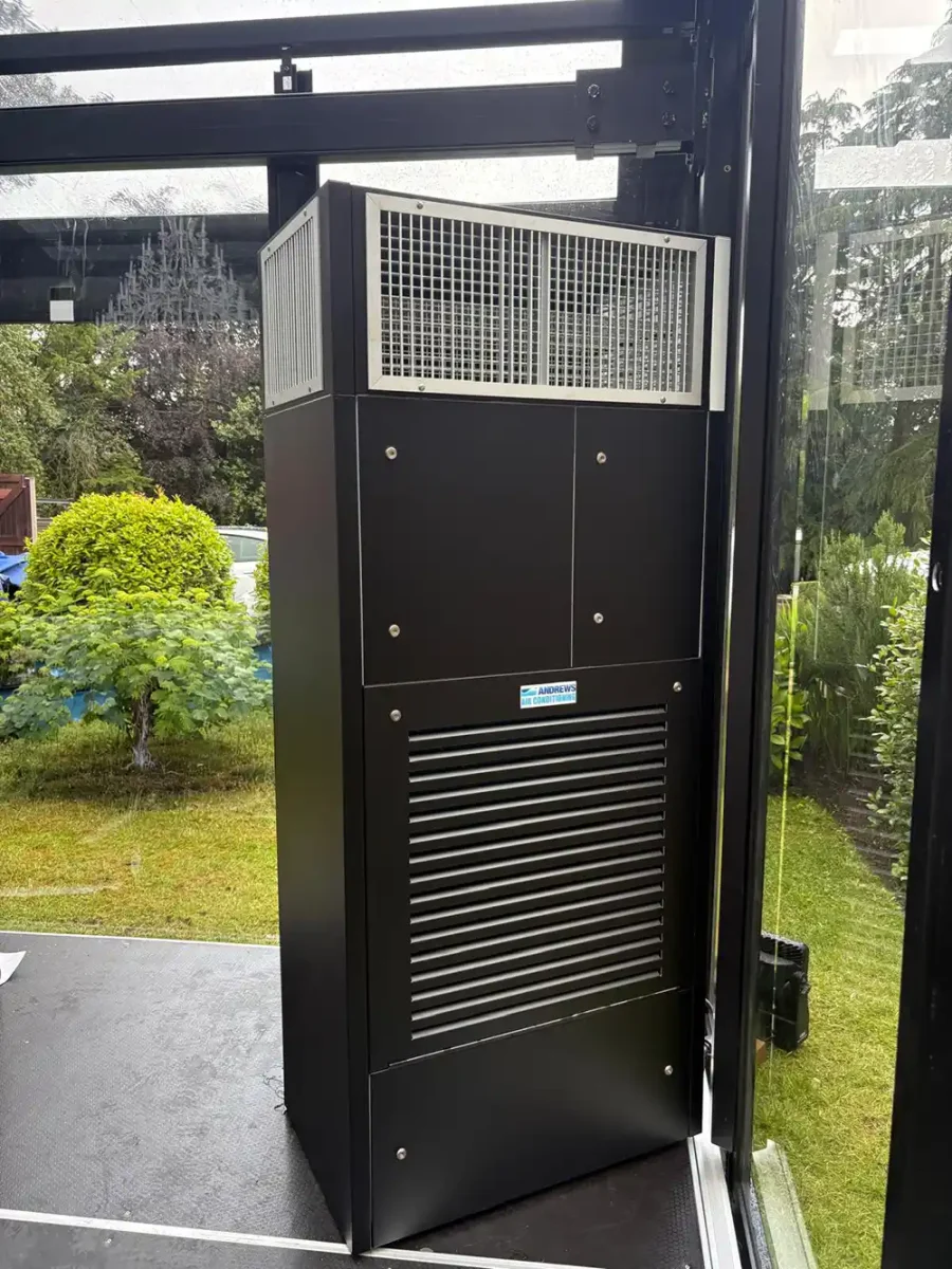 30kW Air Handling Unit Used for Wedding Marquee Cooling Close-up of an Andrews Air Conditioning 30kW air handling unit positioned inside a glass marquee as part of a bespoke wedding cooling system