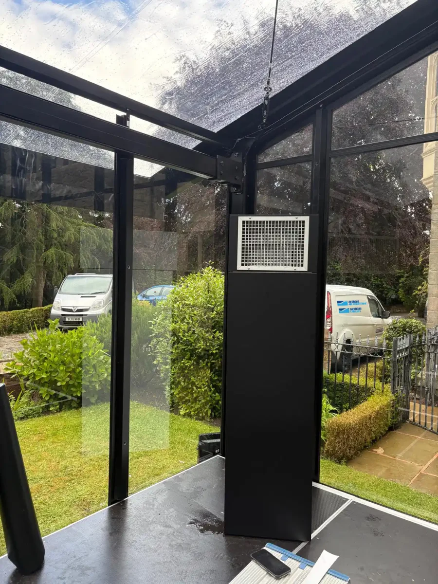 Black Vinyl-Wrapped Air Handling Unit Inside a Glass Marquee Black air handling unit installed inside a glass wedding marquee, wrapped to blend with the venue's black and white colour scheme