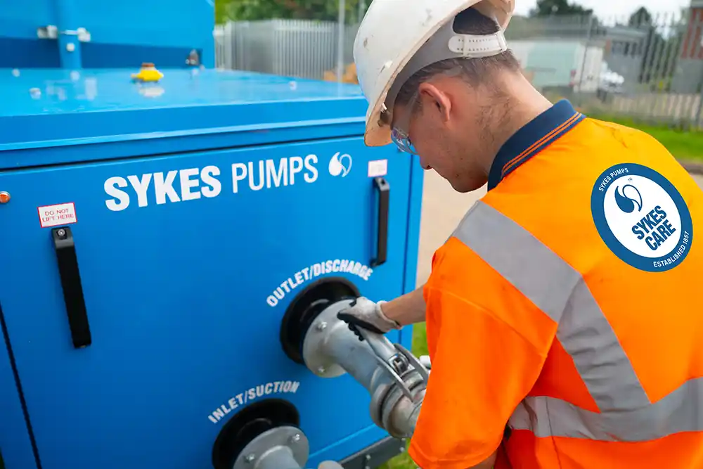 Sykes Care Pump Inspection Sykes Pums engineer inspecting pump connections during planned pump maintenance.