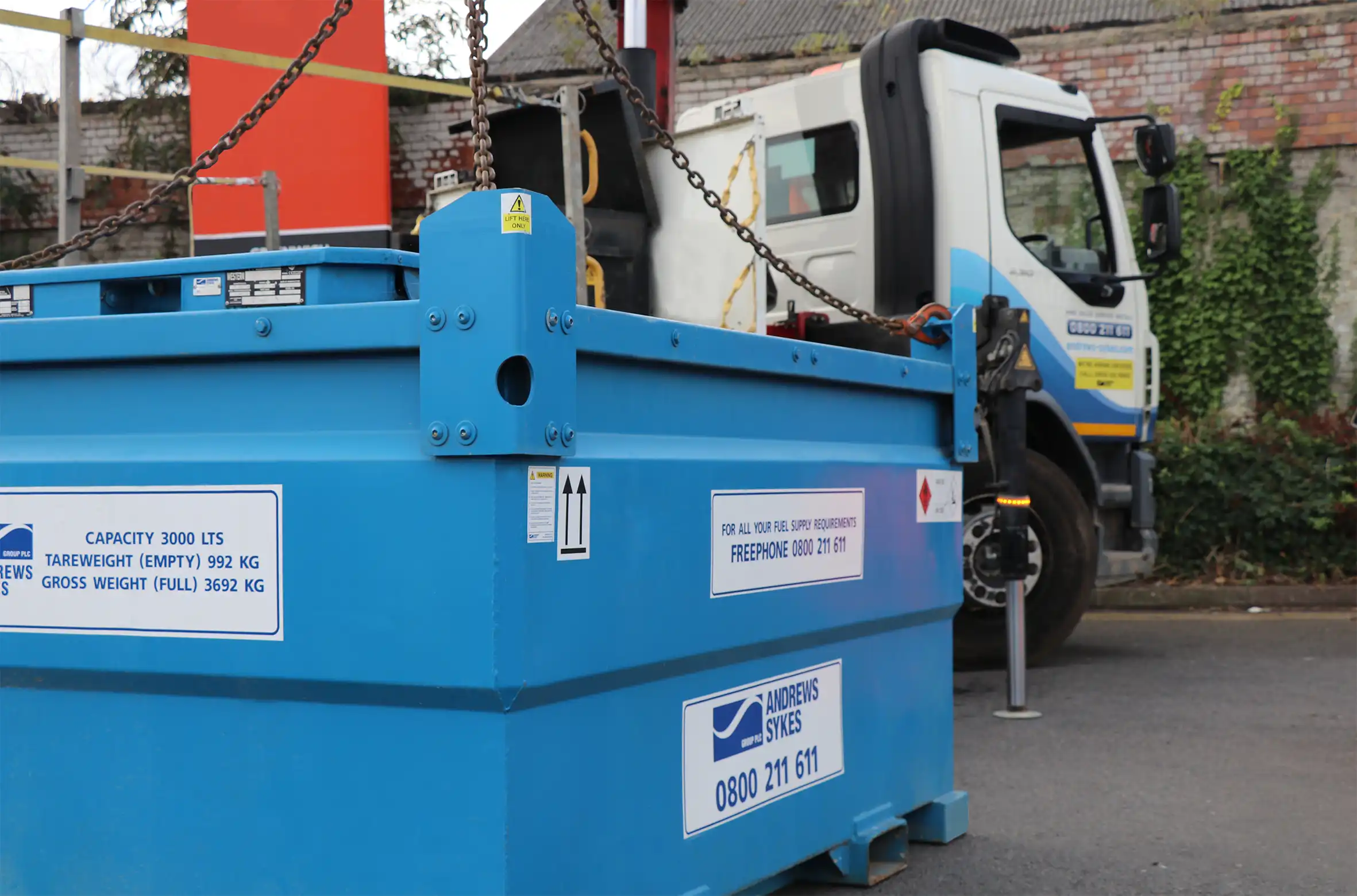 3,000-litre Andrews Sykes fuel tank lifted from a crane lorry for site delivery, ready for HVO as a drop-in diesel replacement