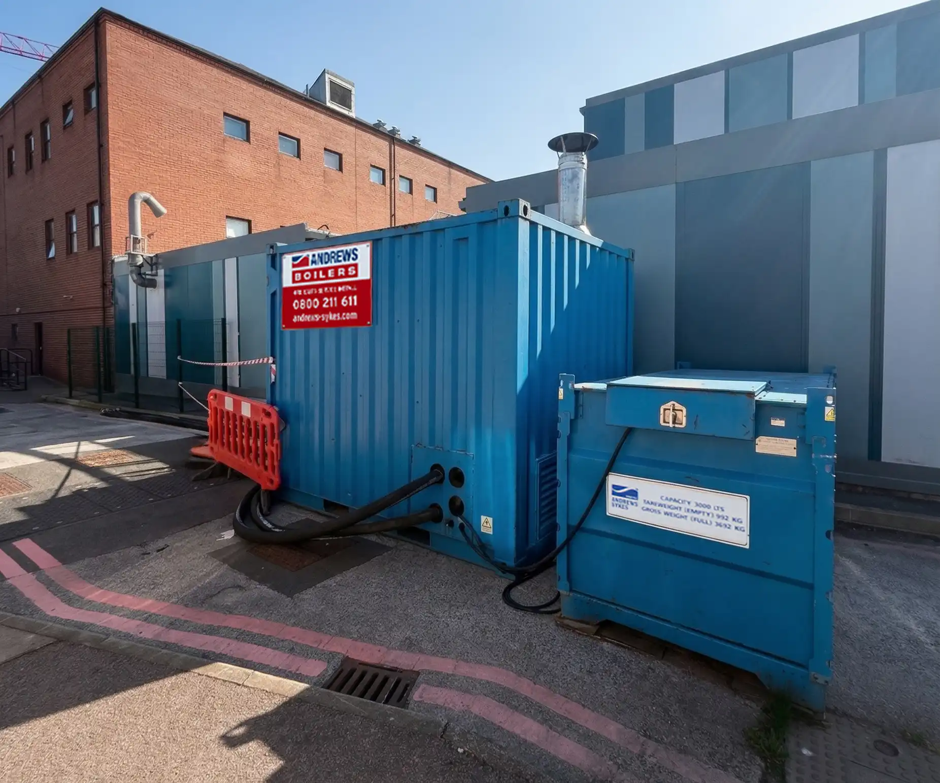Packaged temporary boiler and bunded fuel tank sited beside a facility to maintain heating systems