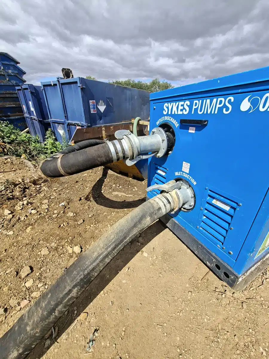 Super Wispaset 100 with suction and discharge hoses Super Wispaset 100 super silenced pump with suction and discharge hoses, transferring reservoir water to temporary storage on a construction site